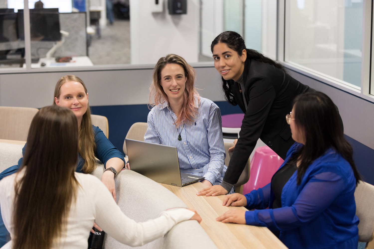 Group of women collaborating in a modern workspace