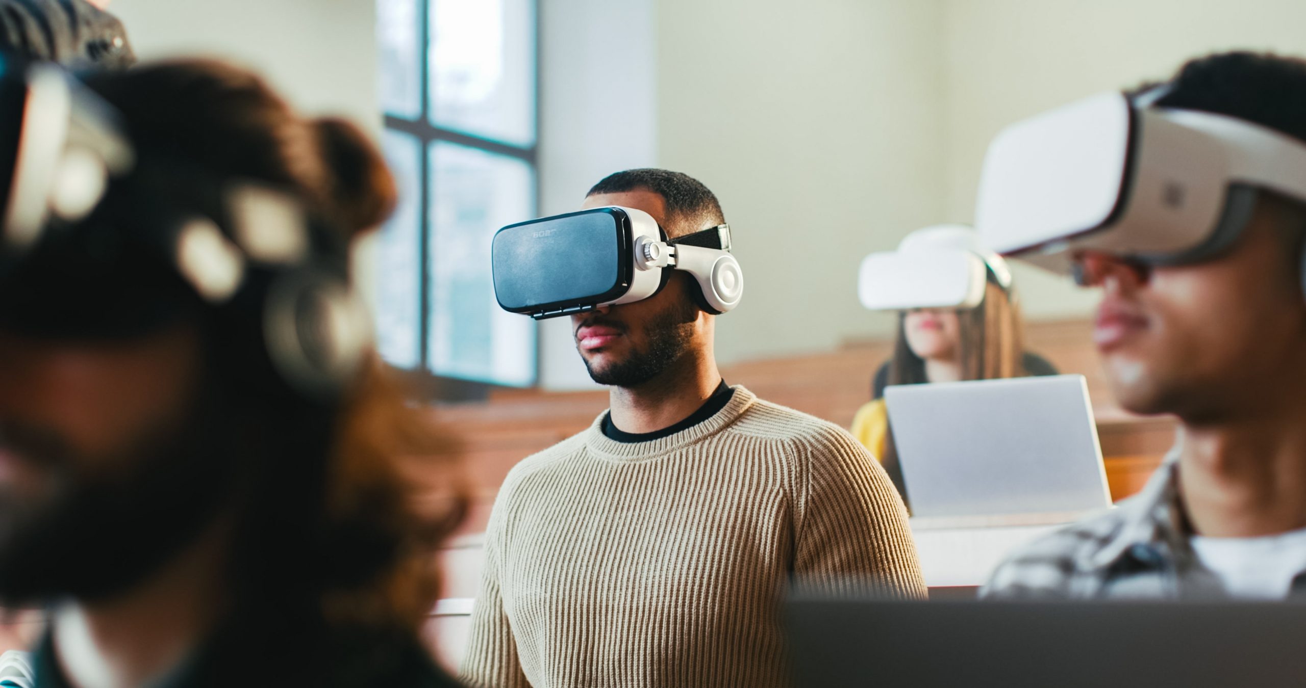 Students using virtual reality headsets in class.