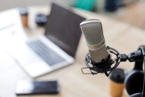 Podcast microphone set up with laptop